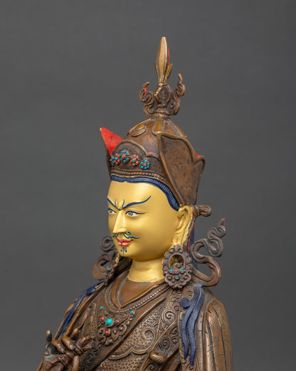 Detailed side view of Tsokye Dorje holding a vajra and a kapala ritual cup, showcasing delicate craftsmanship.