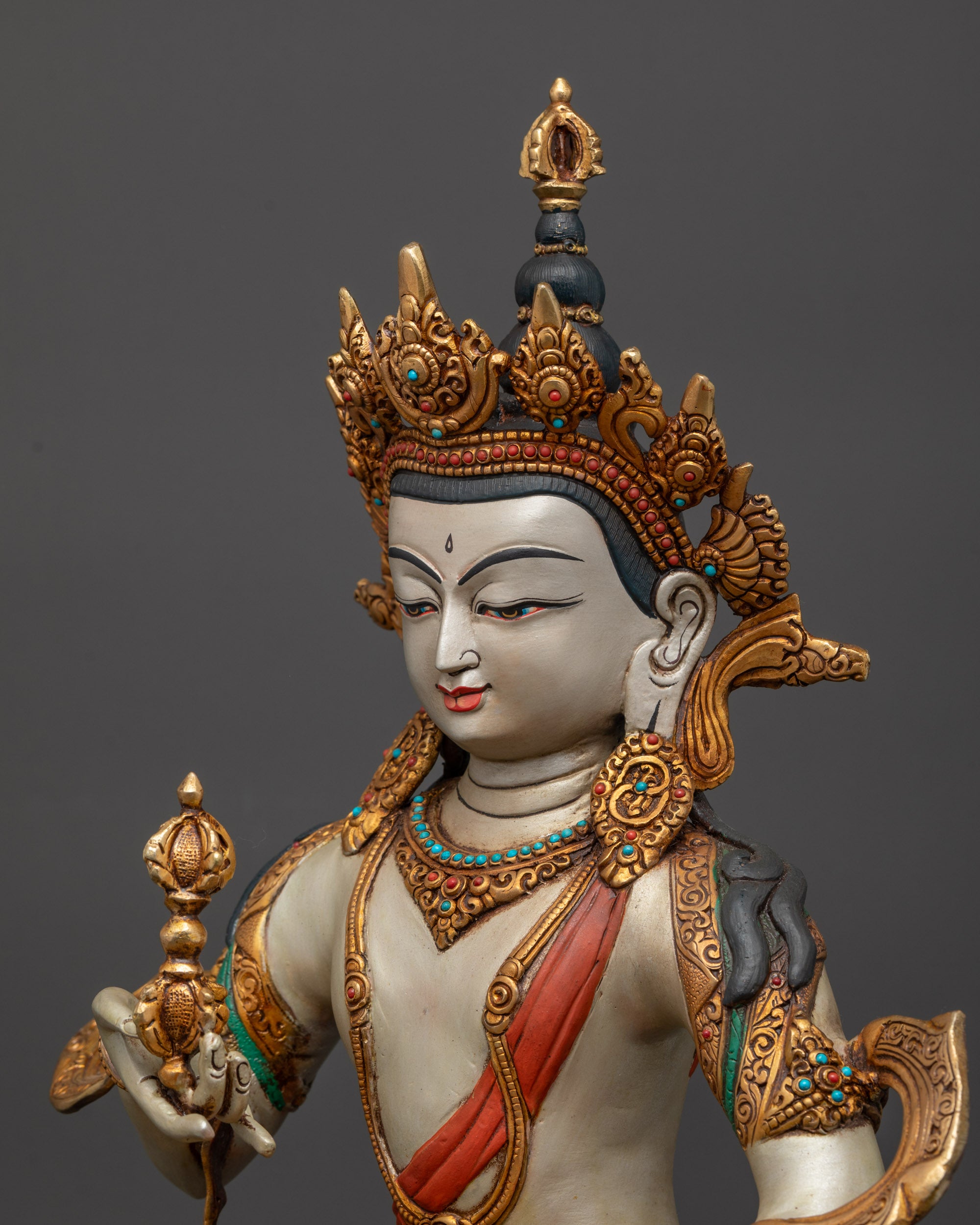 Detailed side view of gold-plated garments and patterned robe
