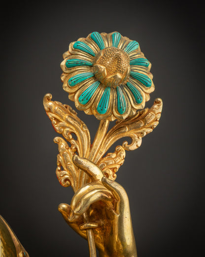 Detailed utpala flower in Chenrezig Statue held by hand representing compassion
