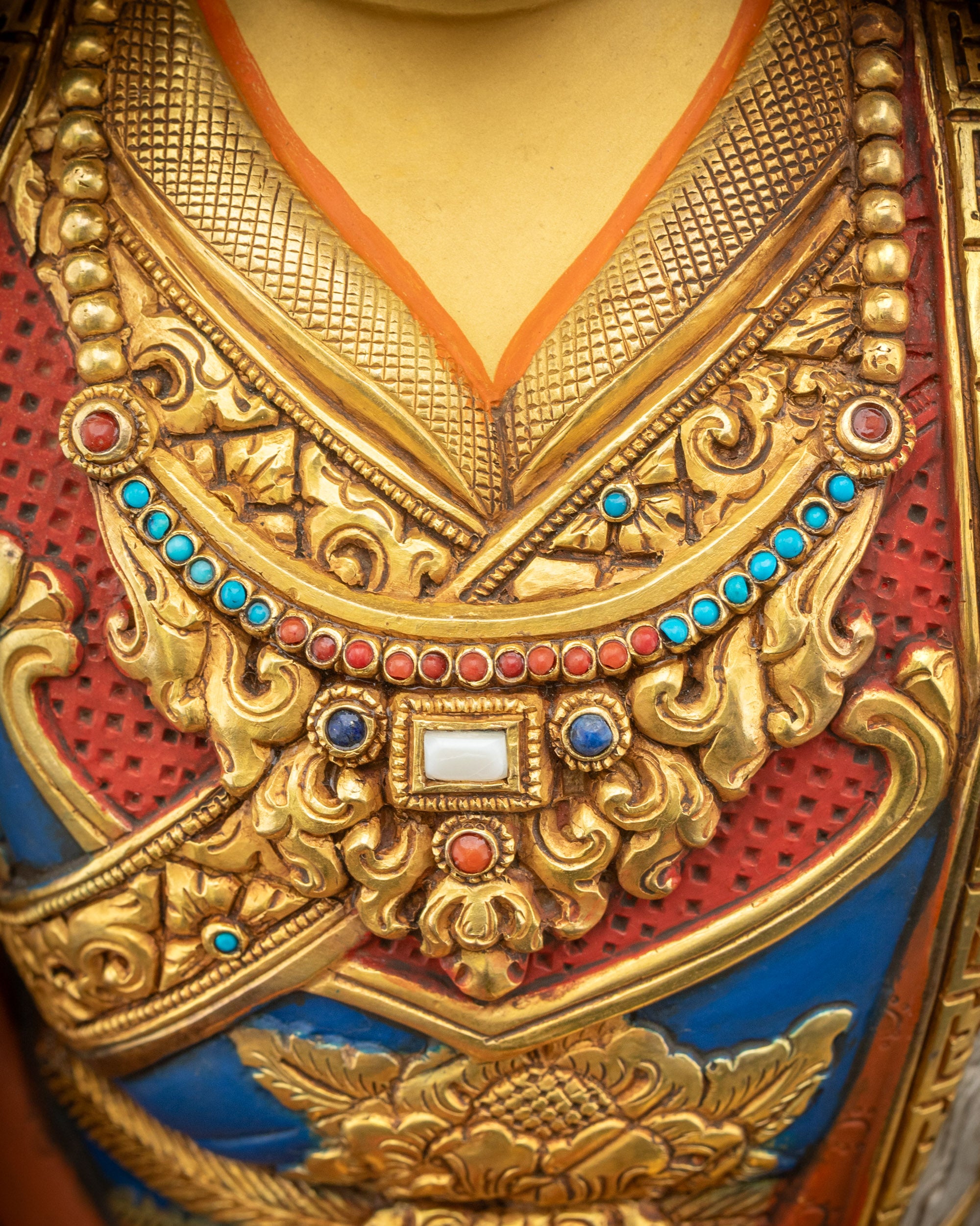 Detailed view of Guru Padmasambhava necklaces with semi-precious stone adornments
