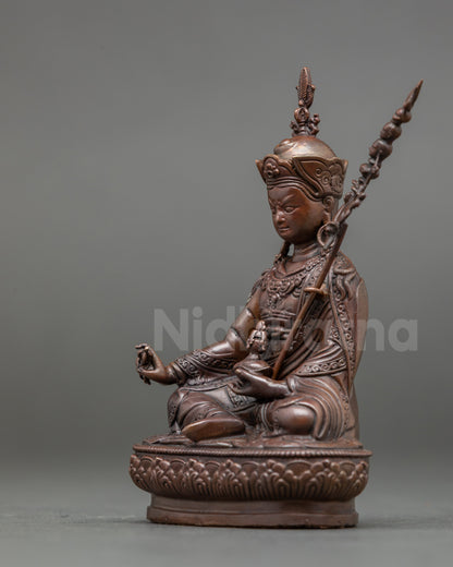 Detailed view of Guru Rinpoche Statue with kapala skull cup and longevity vase
