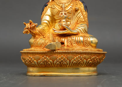 Detailed view of Guru Rinpoche altar statue, kasaya robe, lotus hat, and sacred ornaments