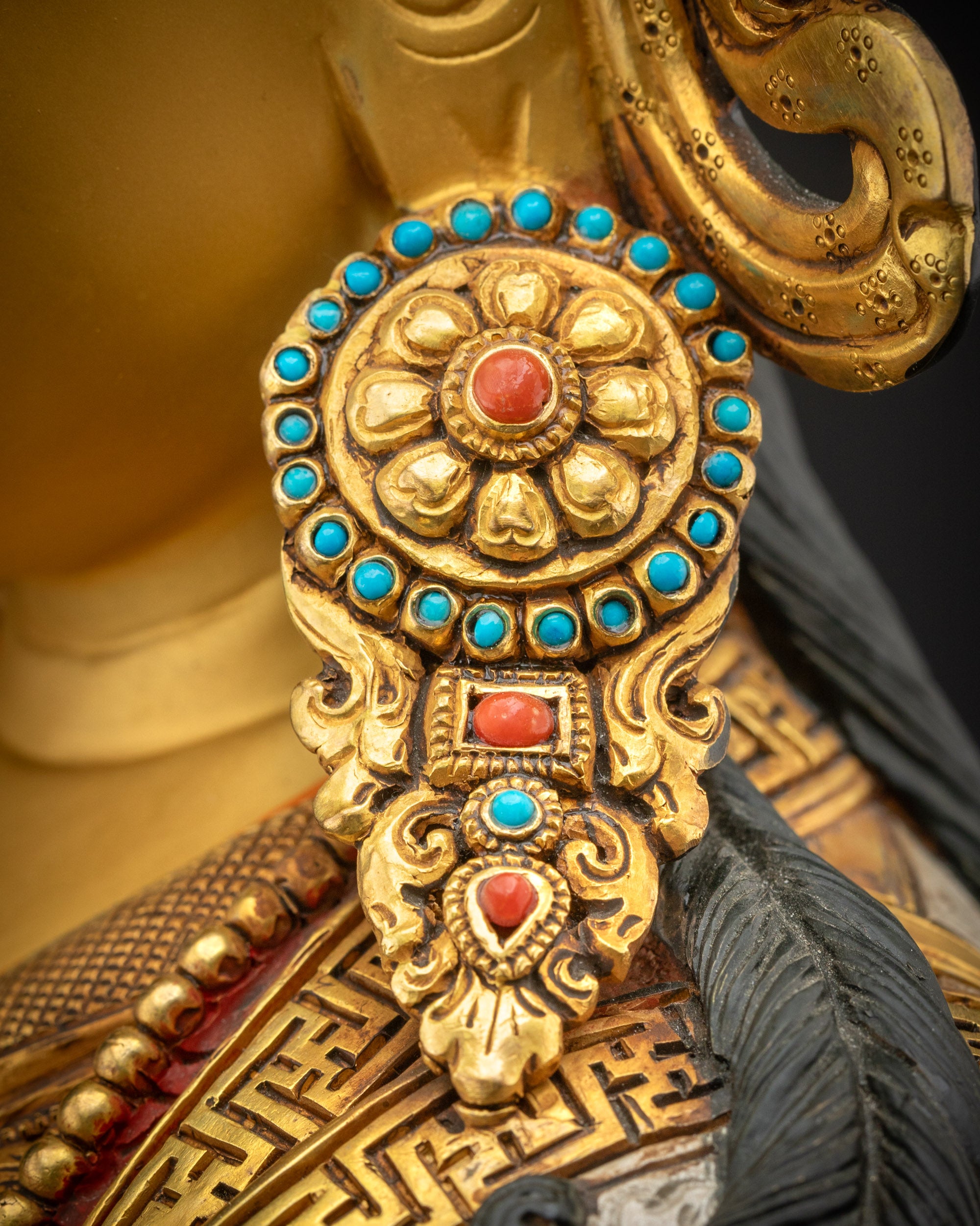 Detailed view of Guru Rinpoche earrings adorned with semi-precious stones