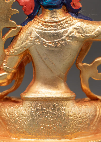 Detailed view of Manjushri statue with utpala flower and lotus throne, Nepalese sculpture