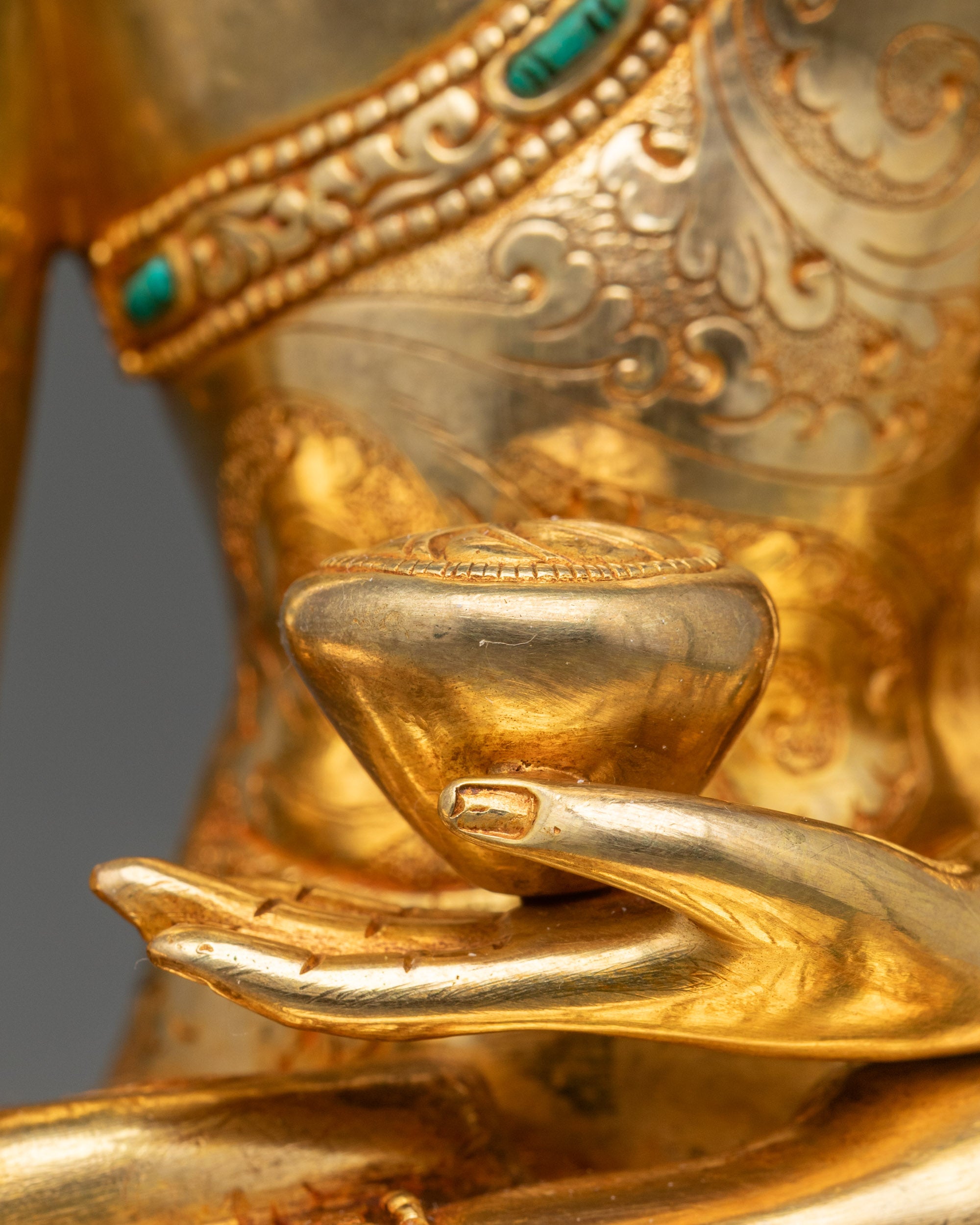 Detailed view of Shakyamuni Buddha hands holding monk’s bowl, meditation pose, Nepalese craftsmanship