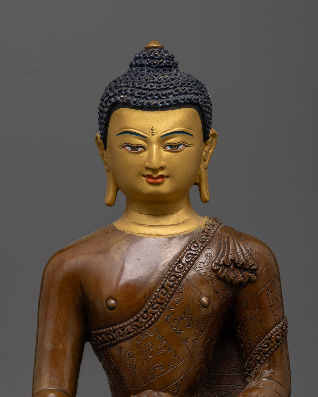 Detailed view of Shakyamuni Buddha's serene 24K gold face and hands in Dhyana mudra meditation posture