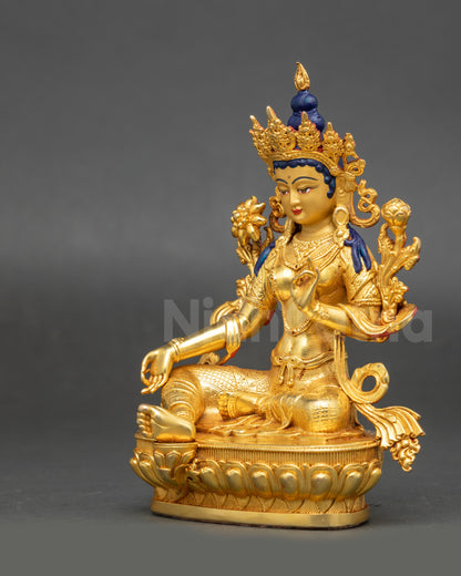 Detailed view of gold-gilded Green Tara Figure highlighting lotus seat and intricate craftsmanship