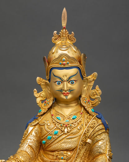 Detailed view of handcrafted Guru Rinpoche statue showing intricate copper work and 24K gold fire-gilding
