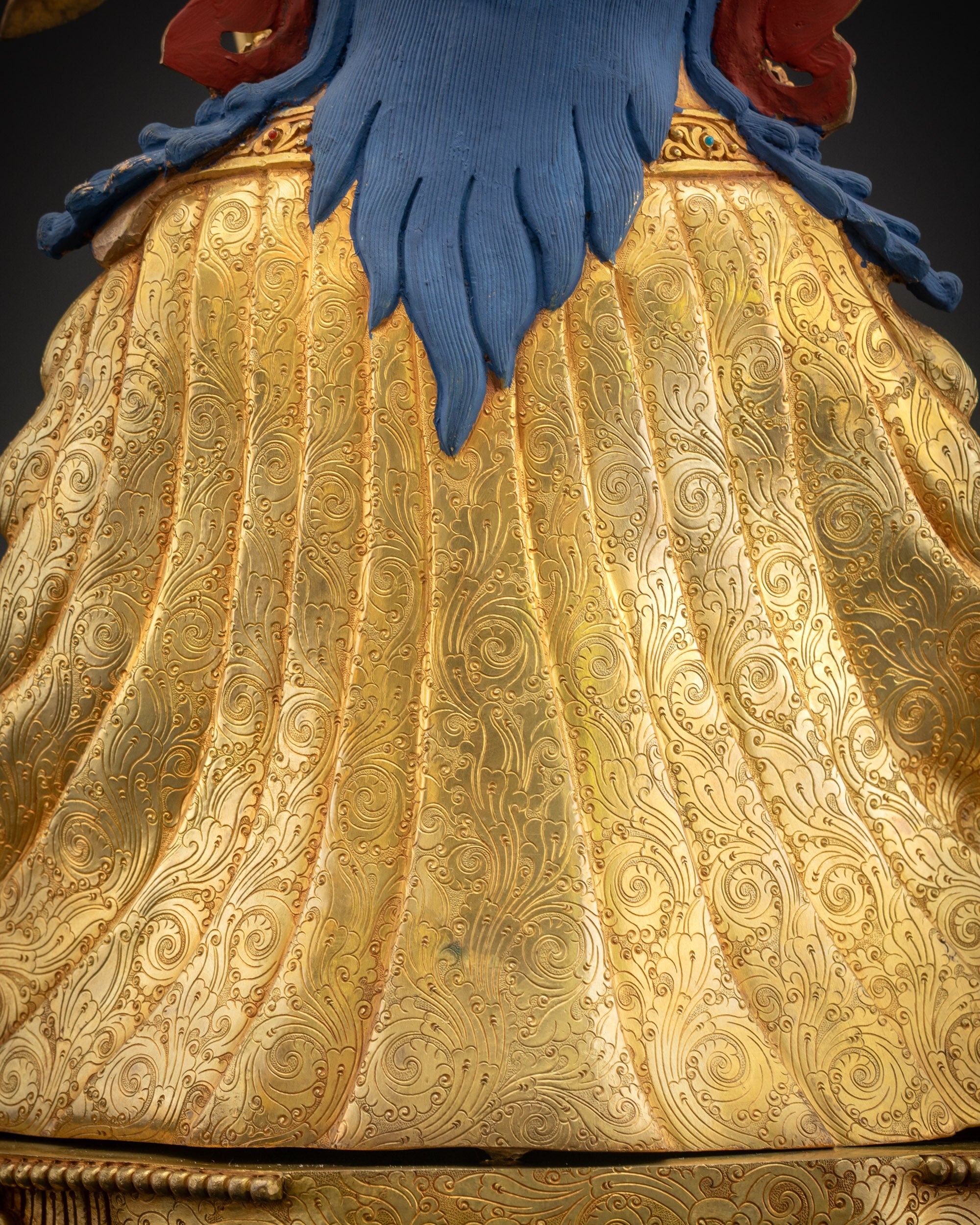 Detailed view of the robe motifs with sacred patterned detailing