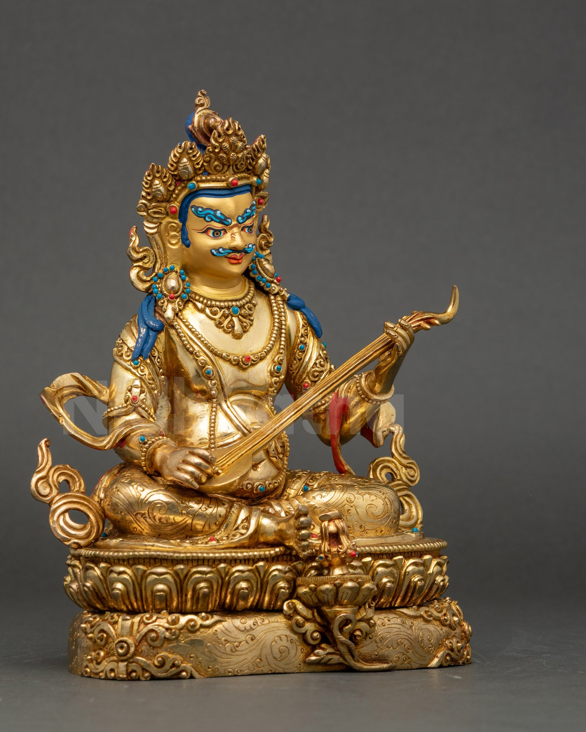 Dhritarashtra East Direction King statue holding stringed instrument