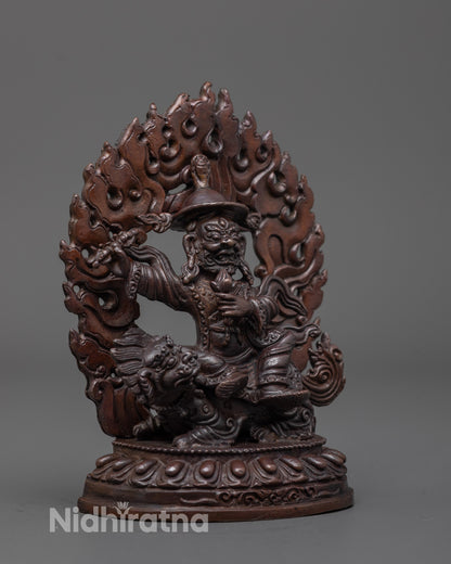 Side angle of Dorje Lekpa statue showing flowing robes, wide-brimmed hat, and vajra detail
