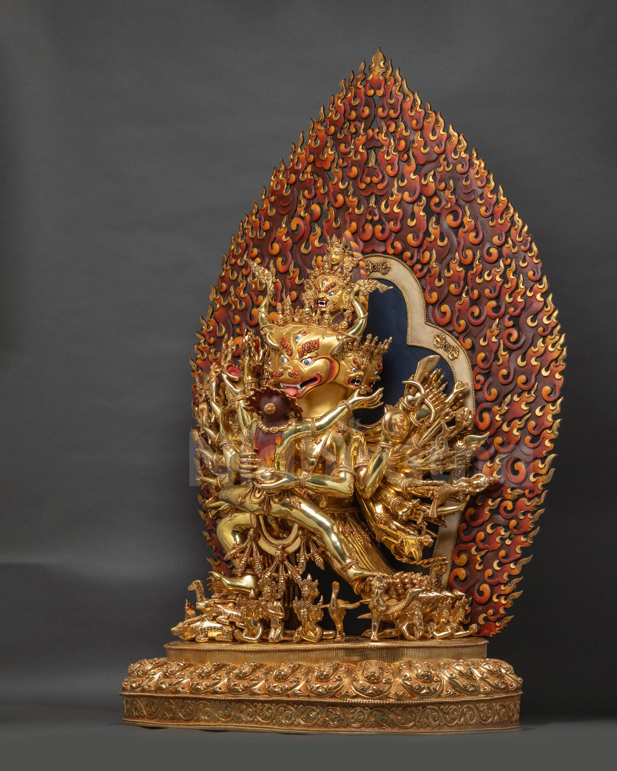 Left side of Vajrabhairava Union sculpture adorned with sacred ornaments and flames halo
