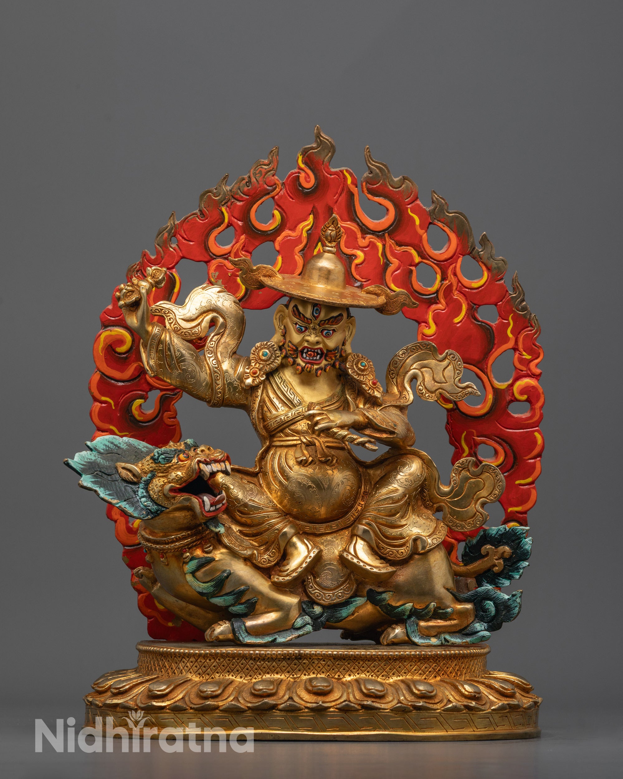 Dorje Legpa statue seated on a lion hand-crafted in Nepal representing fearless protection