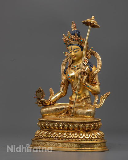 Dukar goddess statue on a neutral background, featuring a consecration chamber at the base and vibrant gold detailing.