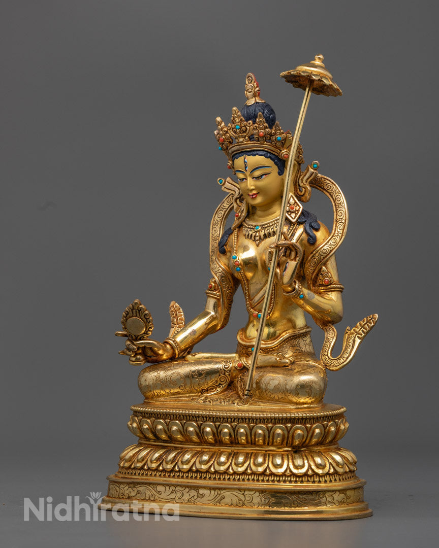 Dukar goddess statue on a neutral background, featuring a consecration chamber at the base and vibrant gold detailing.