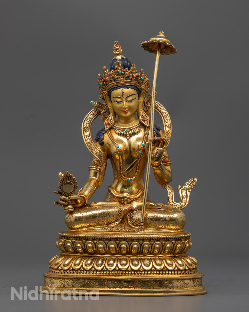 Dukar statue in 24K gold gilded copper, seated in a graceful pose with symbols of prosperity and protection.