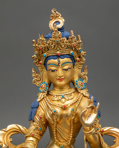 Dukar Statue close up showing gold face and intricate carvings