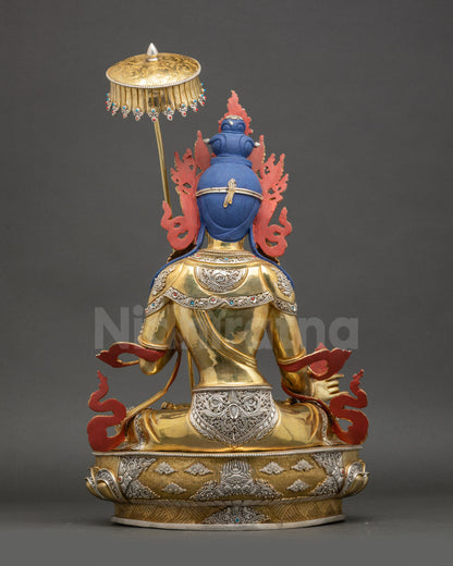 Dukar statue back view flowing robe sun disc ornate detailing