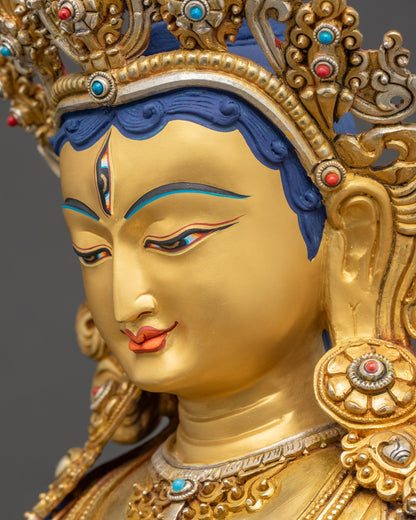 Dukar statue side face close up gold-gilded crown and semi-precious stones