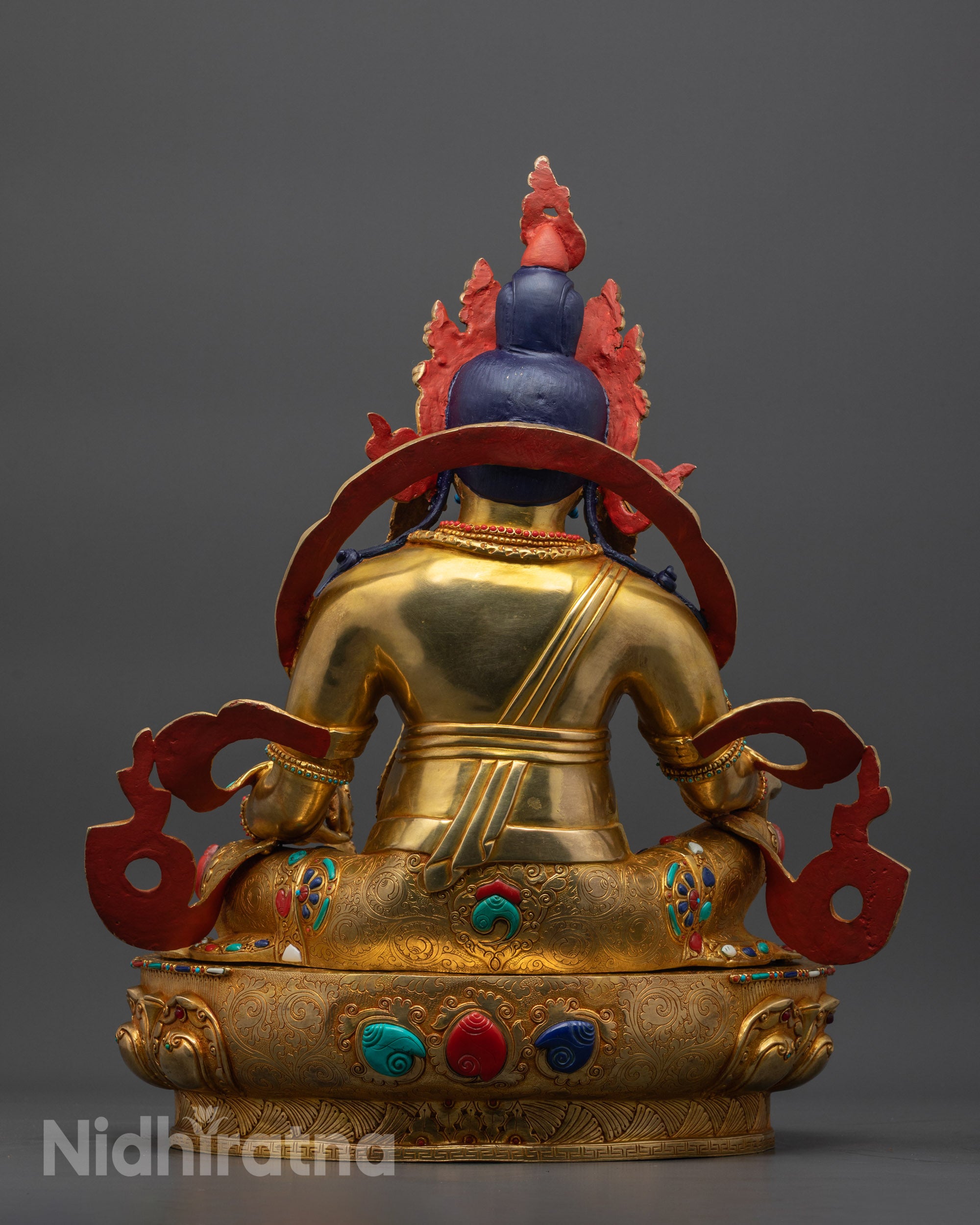 Back view Jambhala Statue with carved robes and serpent wrapped body