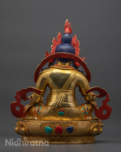 Back view Jambhala Statue with carved robes and serpent wrapped body