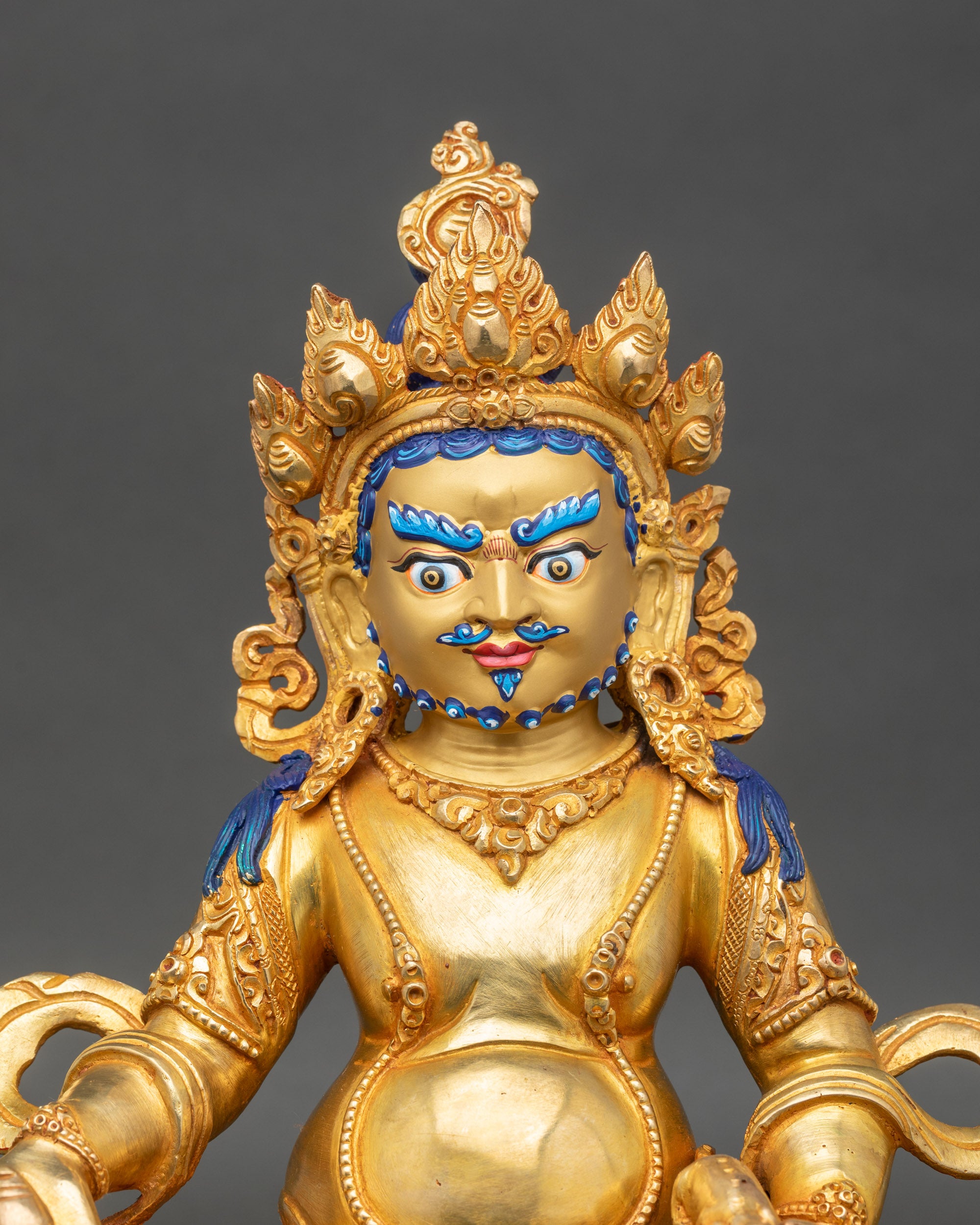 Dzambhala statue close-up, detailed copper craftsmanship and gold fire-gilded Tibetan Wealth Deity