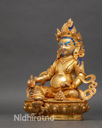 Left side of Dzambhala statue, gold fire-gilded copper, detailed Tibetan Wealth Deity sculpture