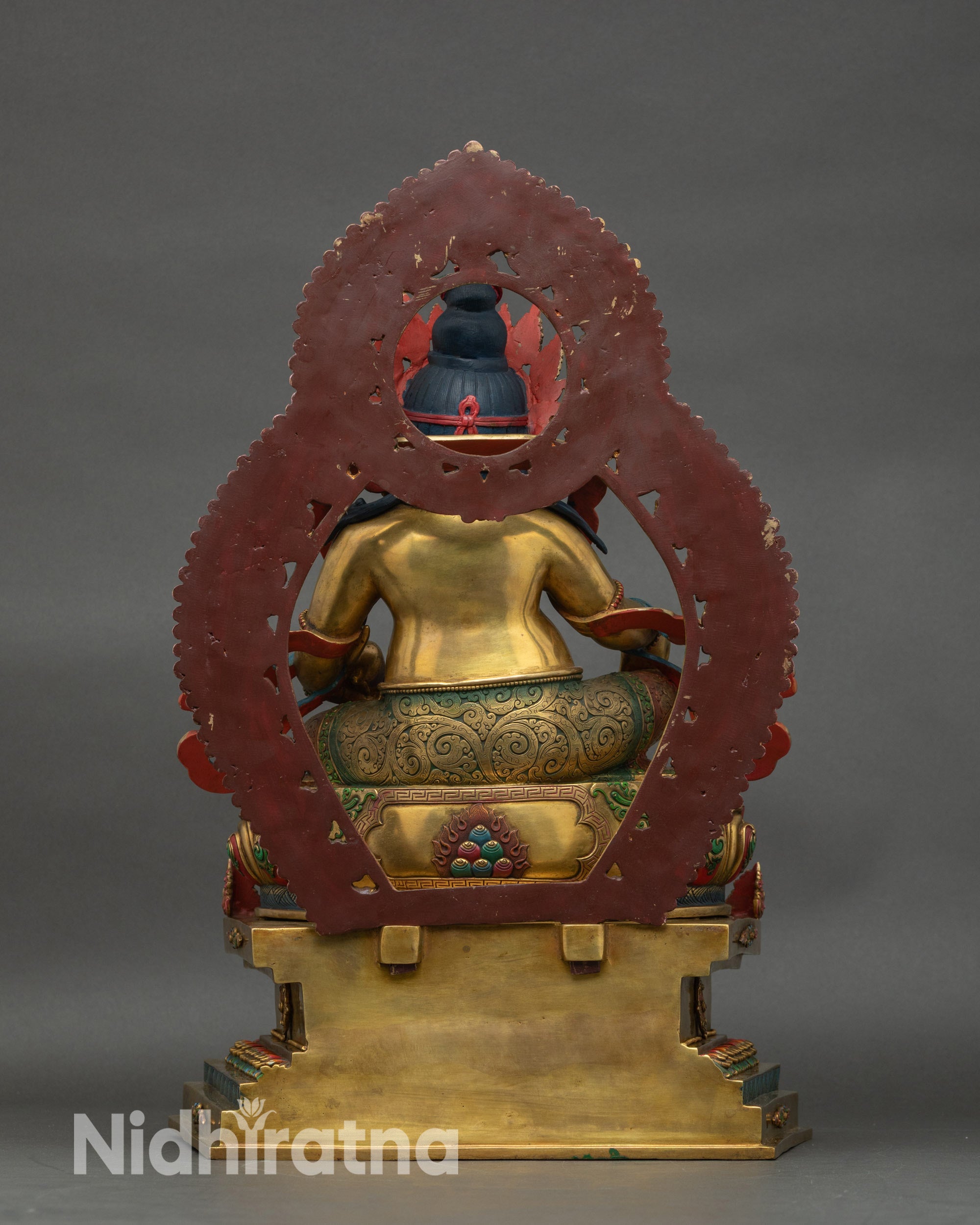 Dzambhala Statue back view, Nepalese artisan-crafted copper sculpture with lotus seat