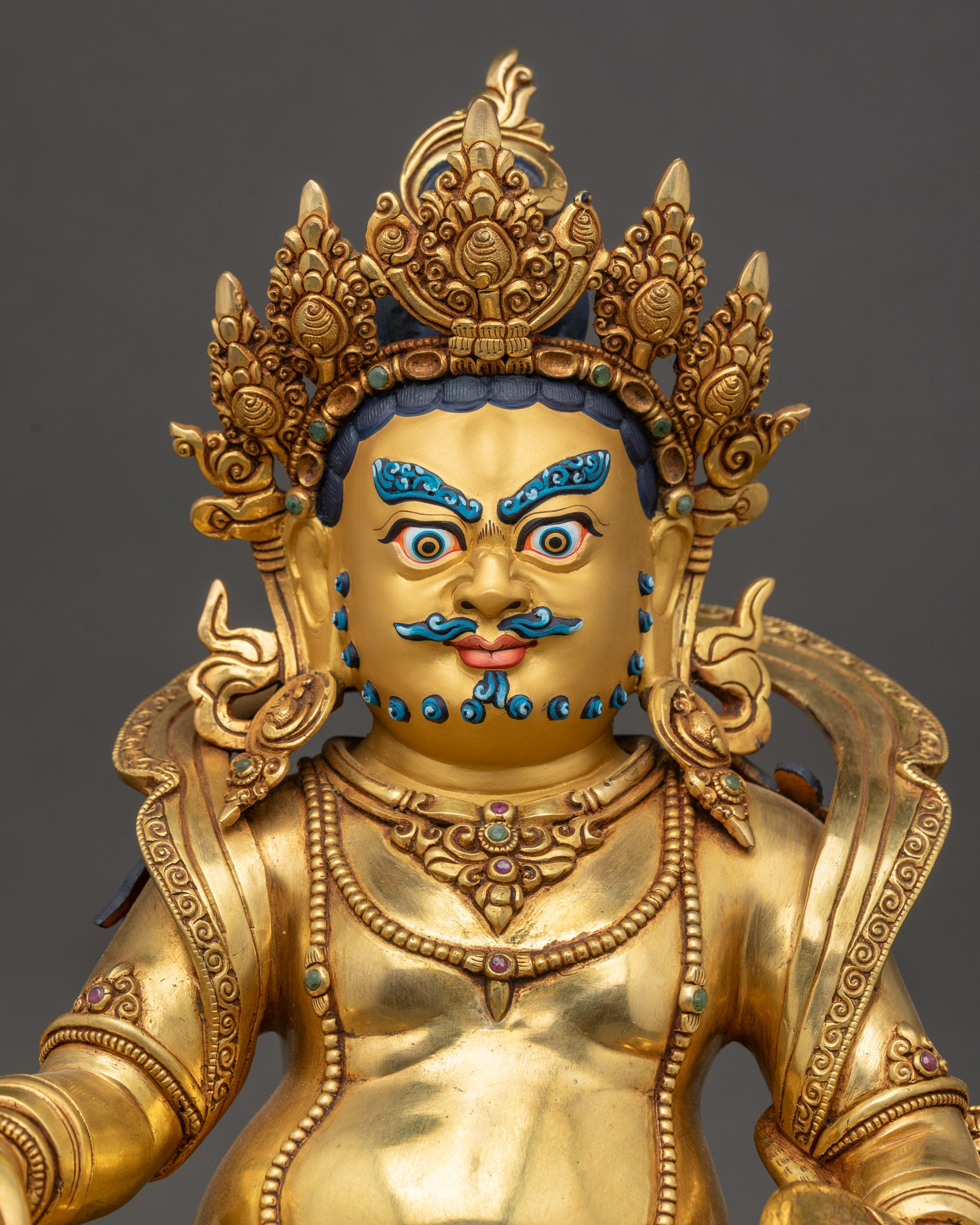 Dzambhala Statue close up showing gold-gilded copper craftsmanship