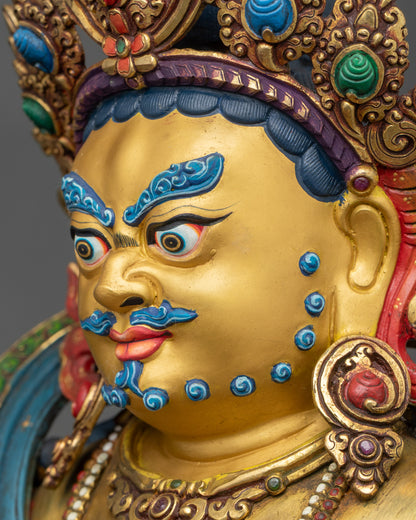 Dzambhala Statue detailed side close-up of face, highlighting citrons and jewels