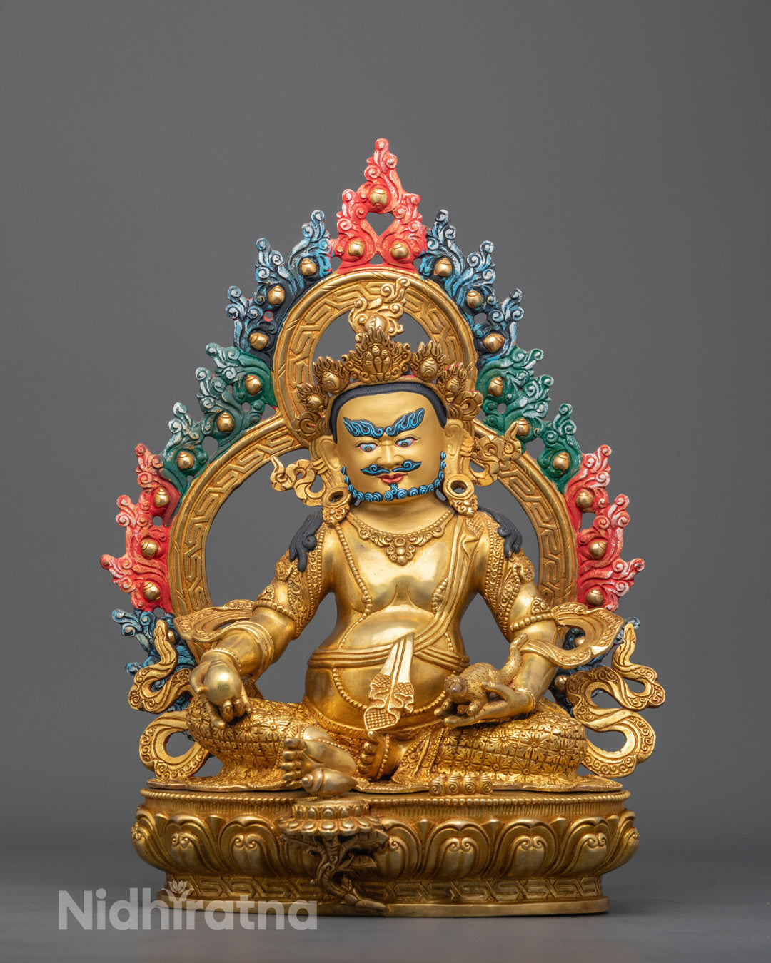 Dzambhala Statue front view with gold-gilded face and lotus throne