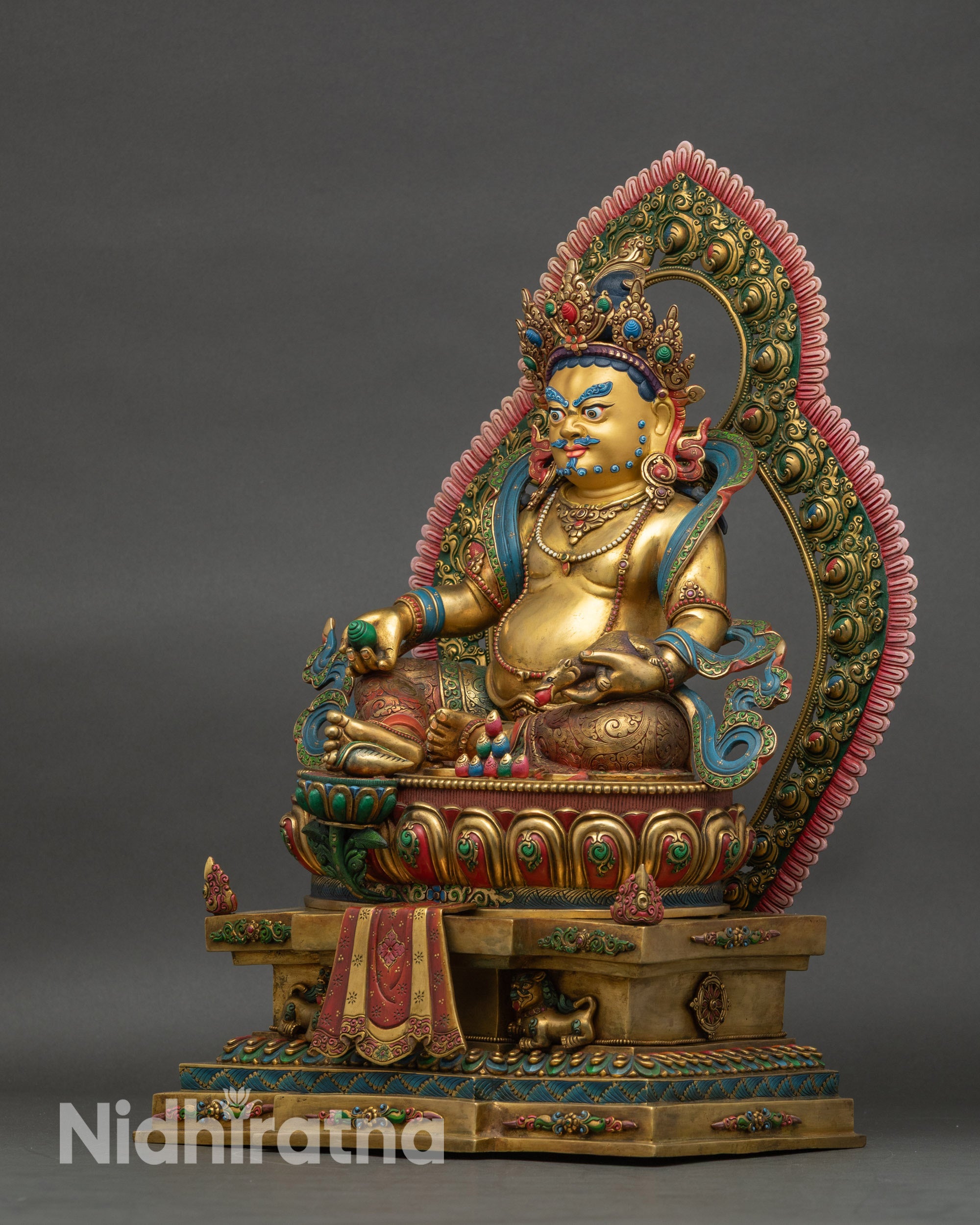 Dzambhala Statue left side view, intricate patterns and hand-painted details visible