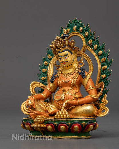 Dzambhala Statue showing citron fruit and jewel-spitting mongoose in royal ease posture