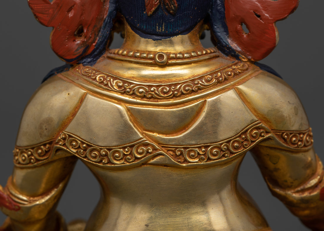 Upper back view of Dzambhala, showcasing the detailed patterns on his robe.