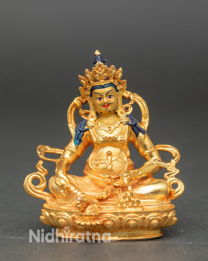 Dzambhala Wealth God statue gold fire gilded with 24K gold painted face seated on lotus throne