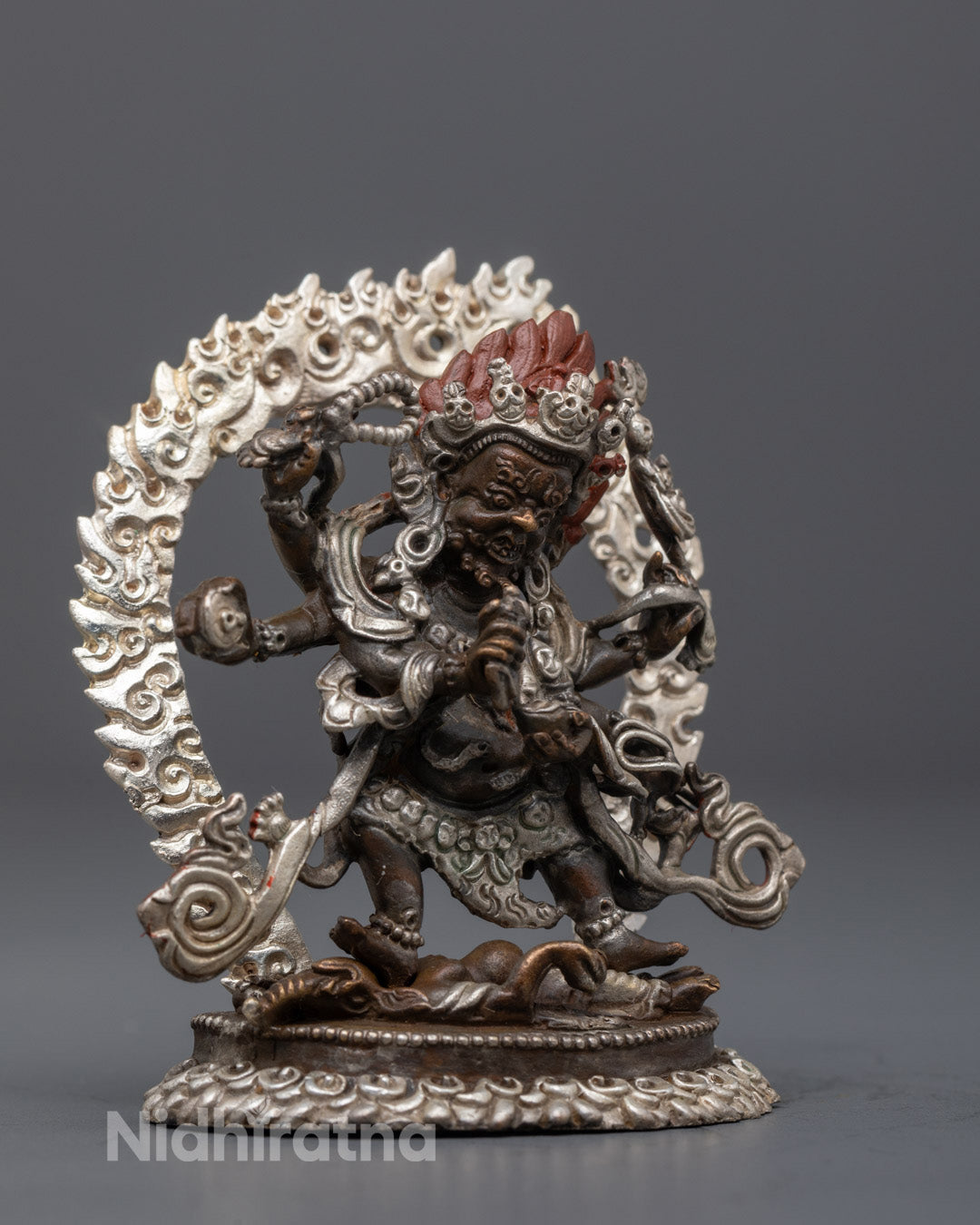 Electroplated Mahakala sculpture with acrylic-painted halo highlighting wrathful deity’s protective energy
