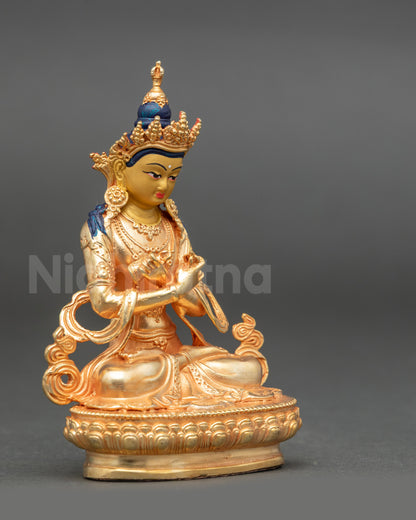 Electroplated Vajradhara Buddha statue holding vajra and bell crossed at the heart
