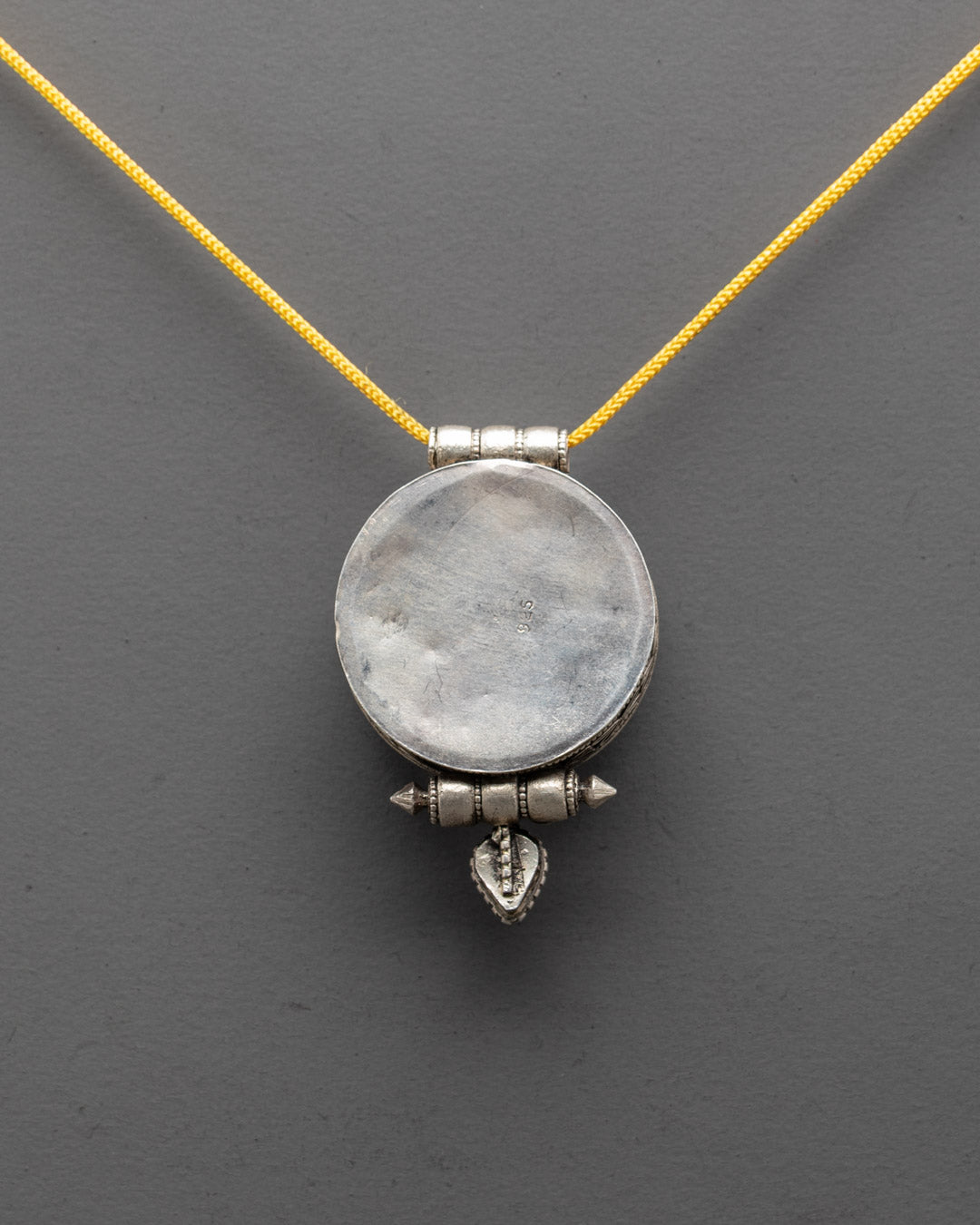 Elegant Infinity Knot Locket handmade by Patan artisans, symbol of harmony and spiritual strength
