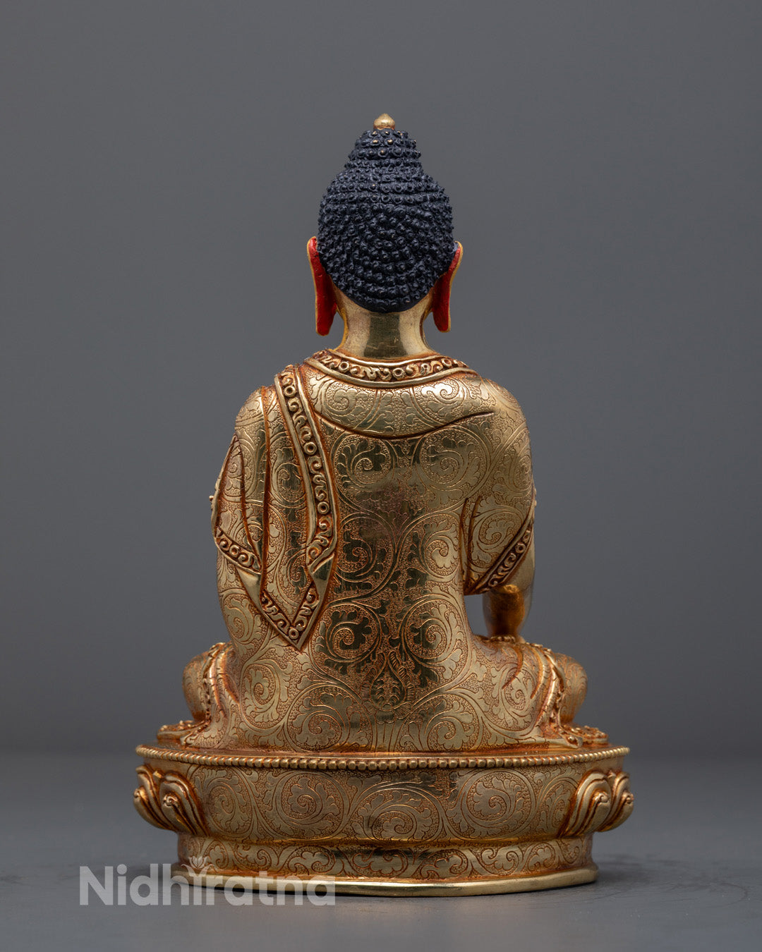 Elegant Shakyamuni Buddha statue with radiant gold finish and intricate craftsmanship, perfect for Buddhist altar or meditation space