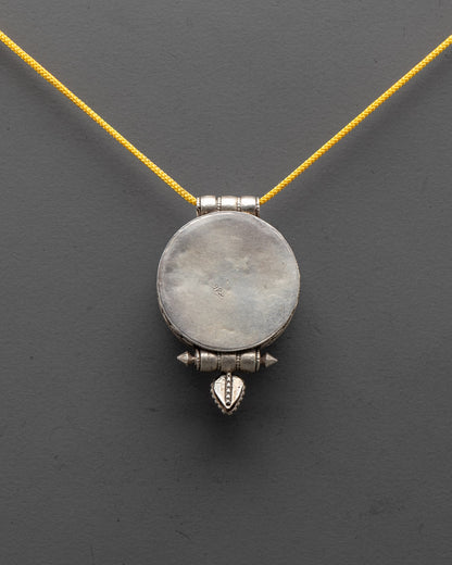 Elegant handmade silver Lotus Locket with filigree design, side profile view