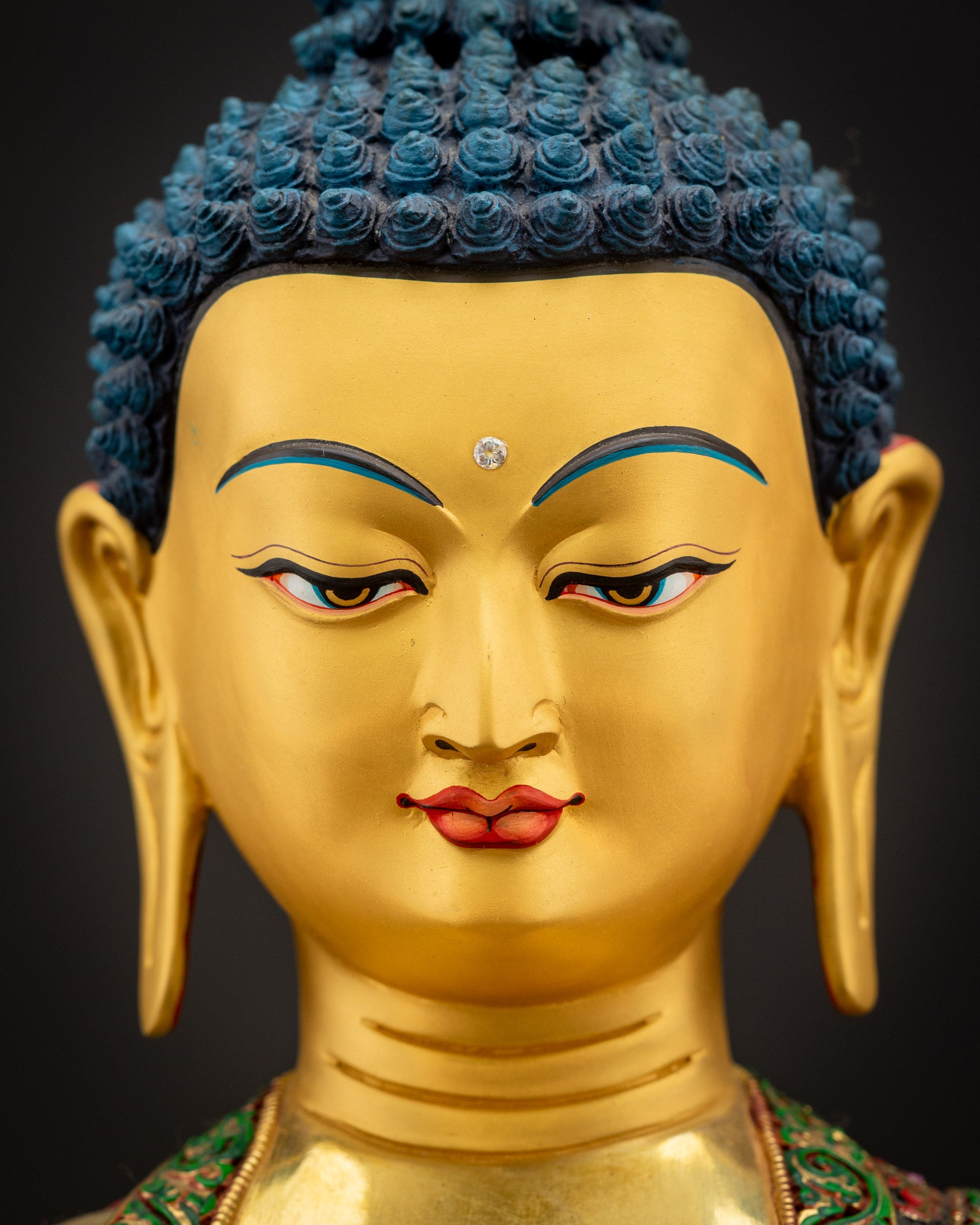 Detailed close-up of Shakyamuni Buddha face with calm, compassionate expression and hand-painted premium acrylic colors