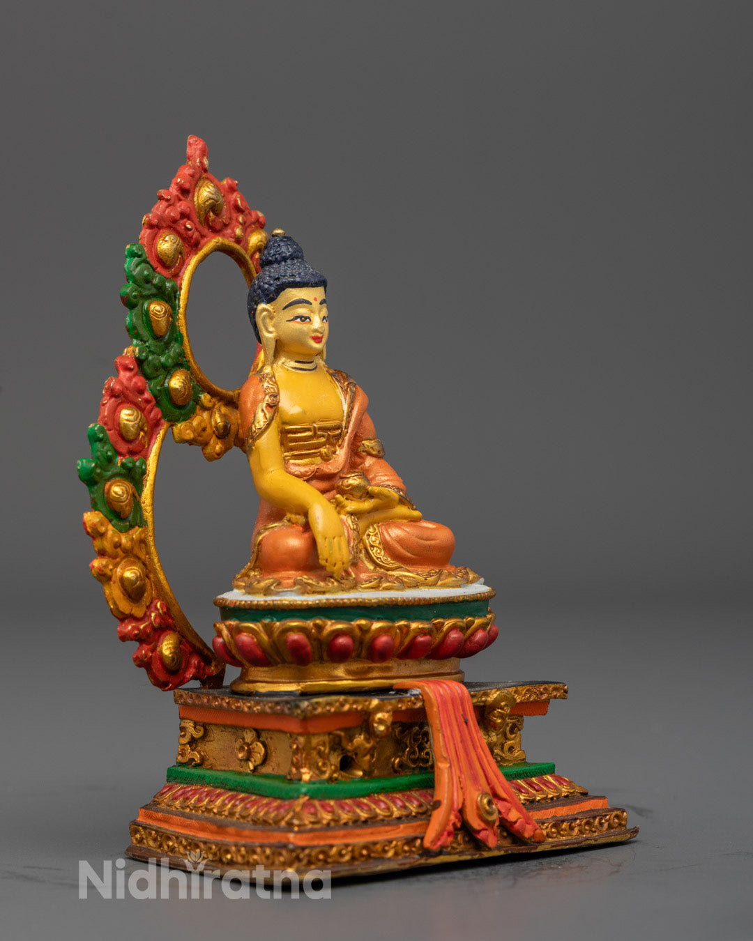 Exquisite electroplated Buddha Shakyamuni sculpture featuring detailed robes and radiant multicolored halo representing enlightenment and wisdom