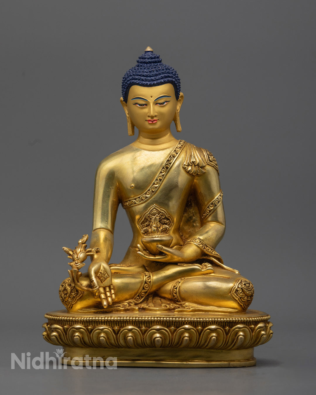 Exquisitely handcrafted Medicine Buddha Statue made from 24K gold-gilded copper, featuring intricate details and symbols of healing, wisdom, and balance.