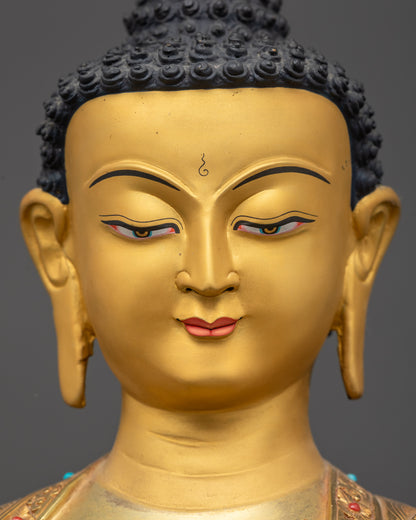 Detailed close up face Shakyamuni Buddha statue gold-gilded serene expression
