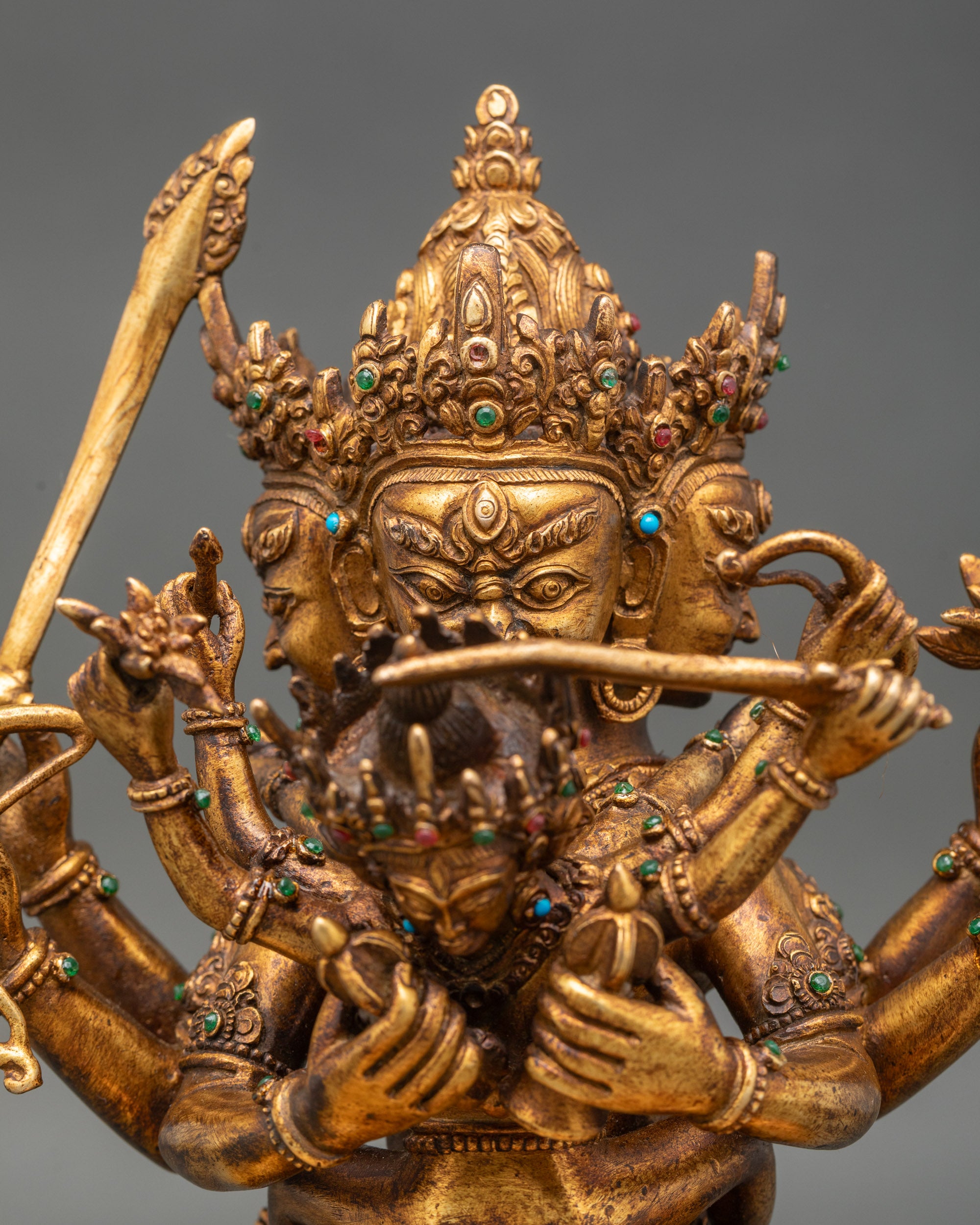 Guhyasamaja Manjushri statue detailed close up face gold fire gilded