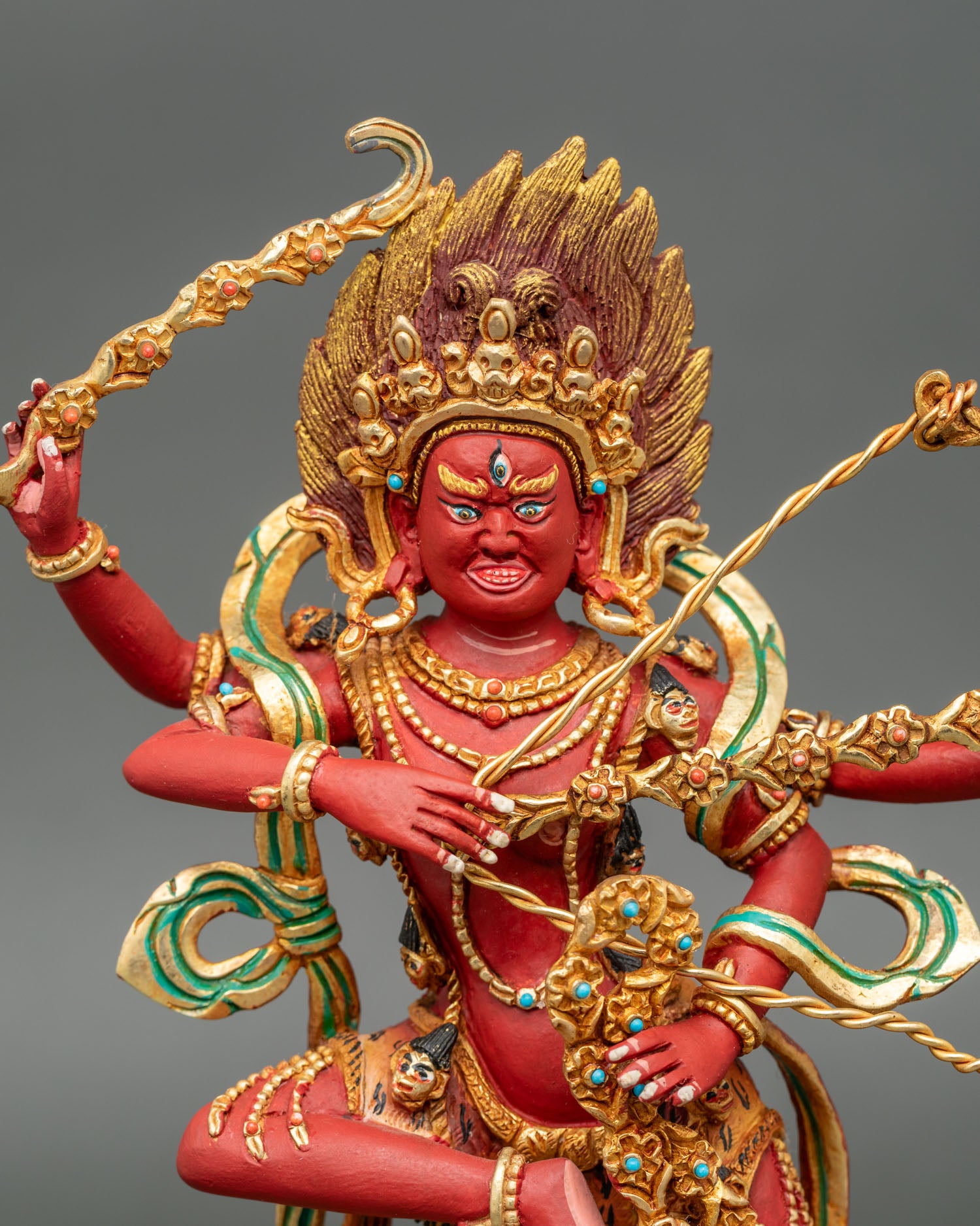 Close up kurukulla buddhist dakini face halo semi precious stones detail