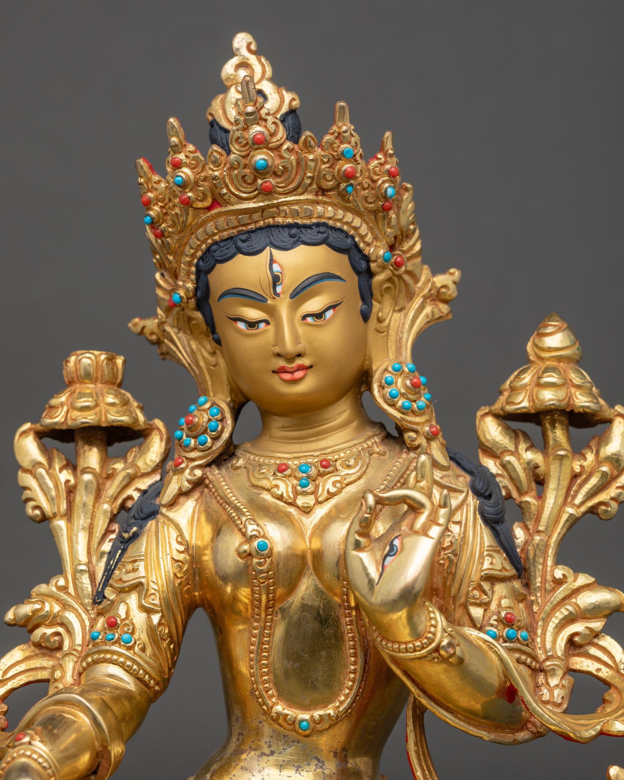 Close up White Tara golden face seven eyes semi-precious stones crown