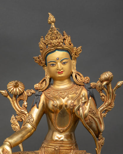 Close up Green Tara face showing serene expression, ornate crown, detailing