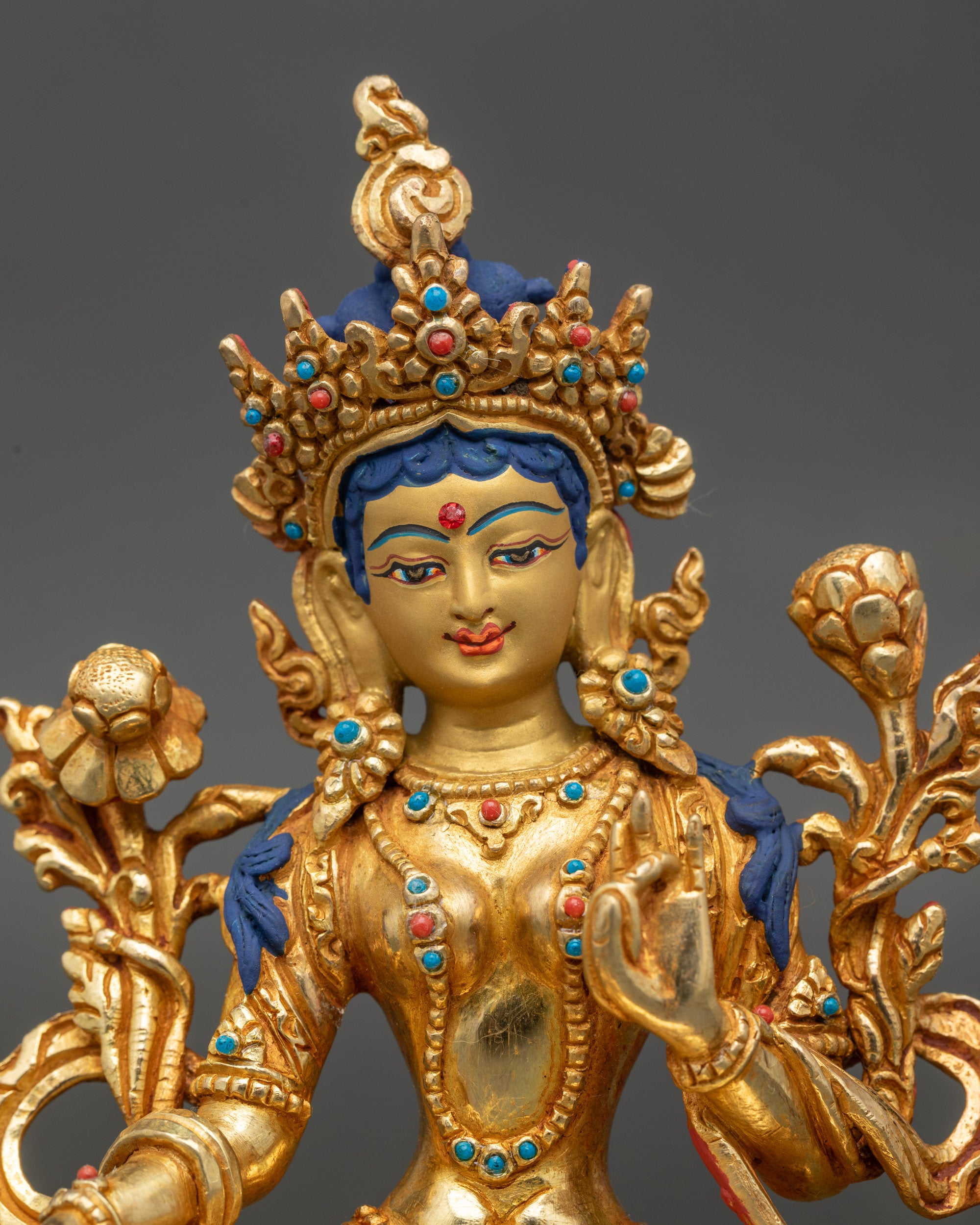 Close up Green Tara face, gold-painted finish, Newari craftsmanship from Patan
