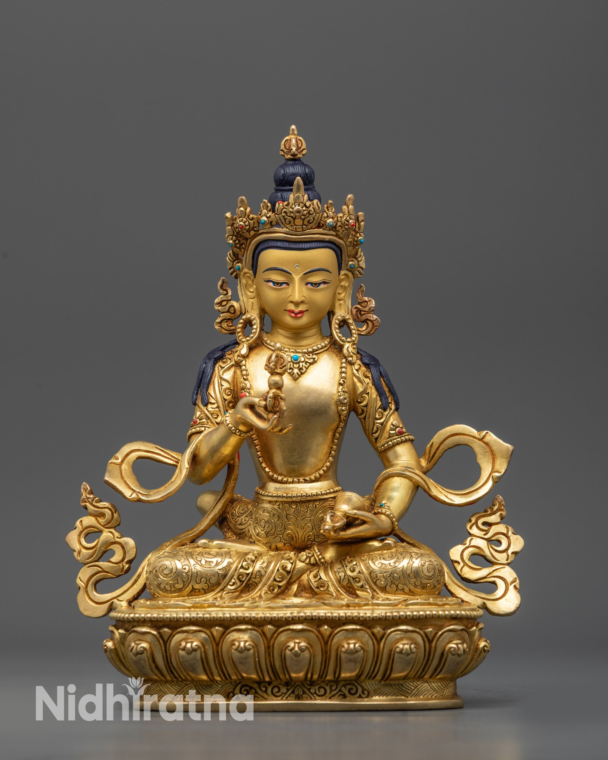 Close up Dorje Sempa Vajrasattva statue showing five-jeweled crown and intricate patterns